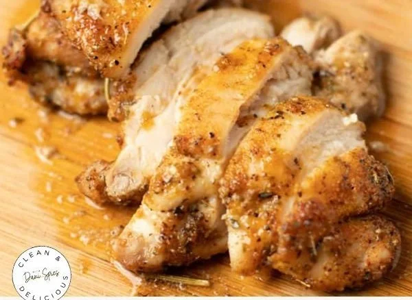 Baked boneless skinless chicken thighs served with herbs and spices