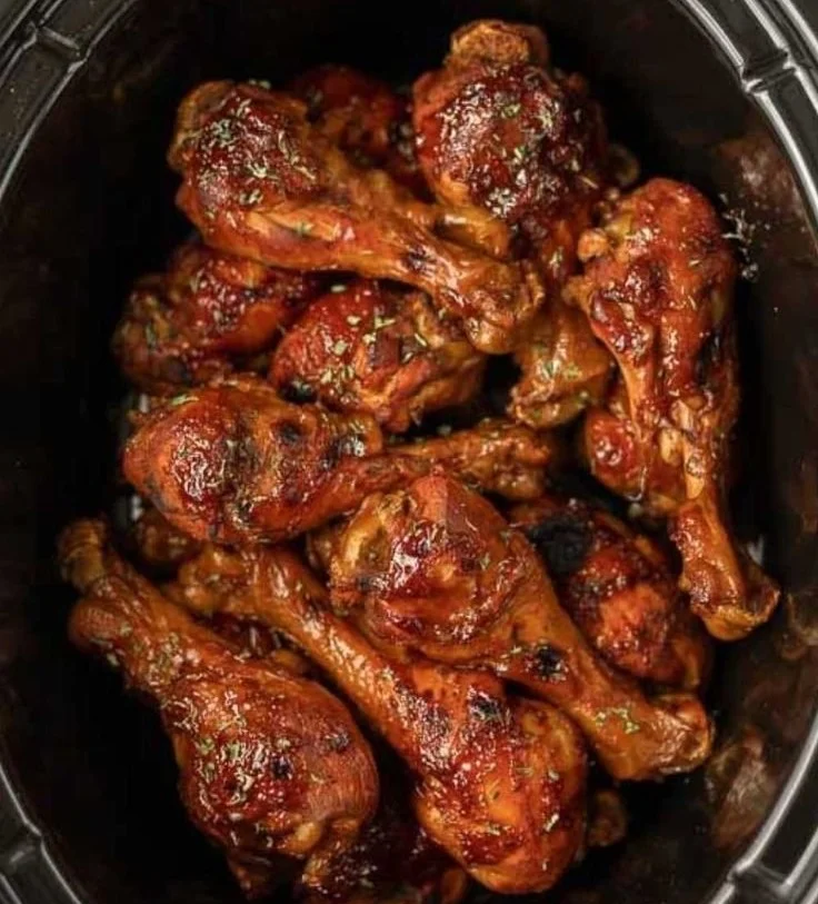 BBQ chicken legs cooked in a crock pot with savory glaze