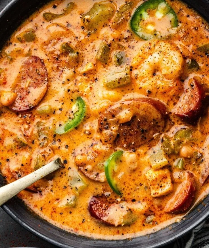 Bowl of Cajun white chicken chili topped with fresh herbs and spices