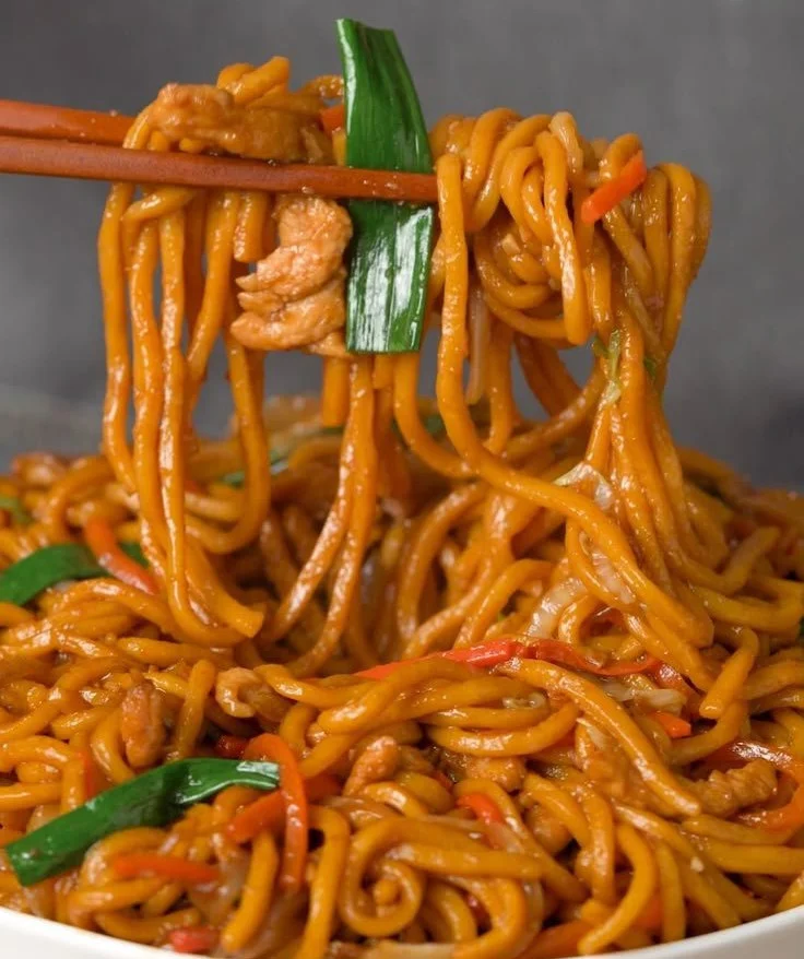 Delicious Chicken Lo Mein dish served with colorful vegetables.