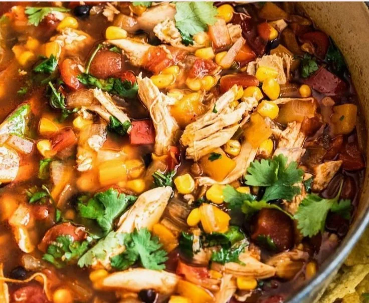 Bowl of Chicken Tortilla Soup topped with tortilla strips and cilantro