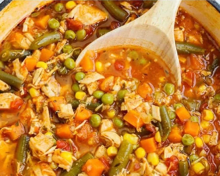 Bowl of homemade Chicken Vegetable Soup with fresh vegetables and herbs