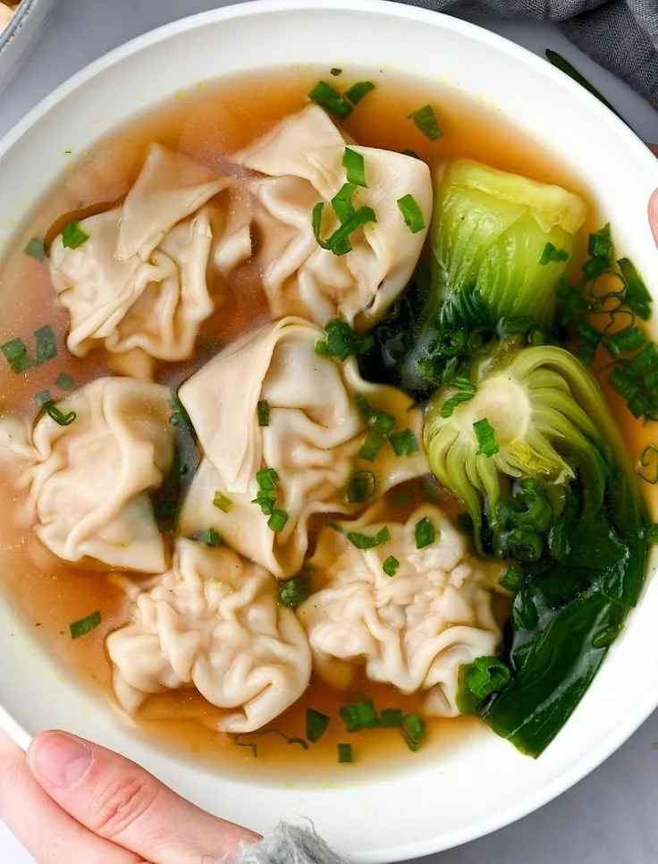 Bowl of Chicken Wonton Soup with chicken, wontons, and green onions