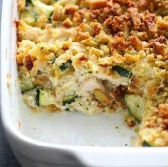 Delicious Chicken Zucchini Casserole topped with cheese and fresh herbs