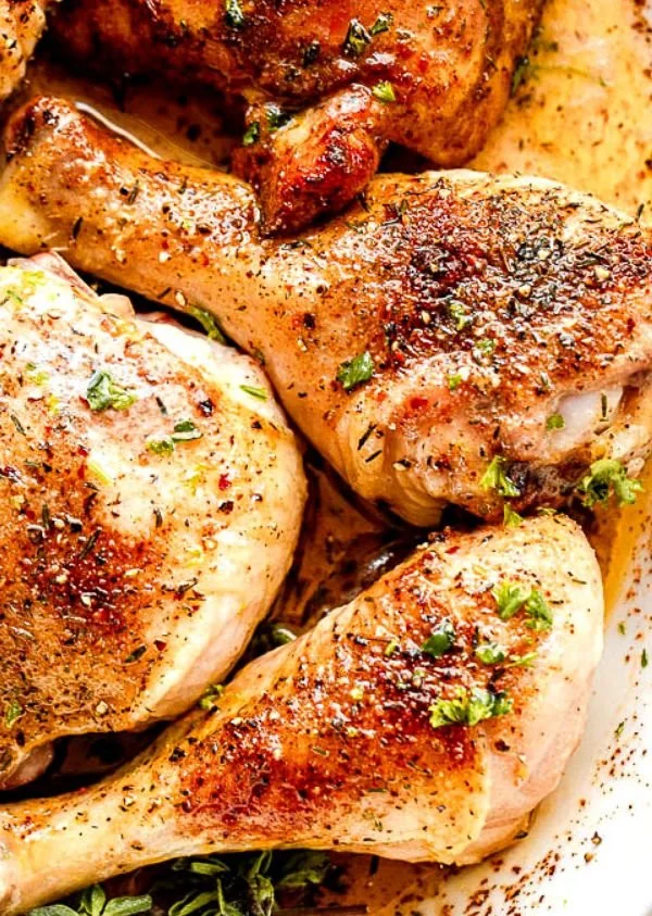 Juicy classic baked chicken pieces served on a plate