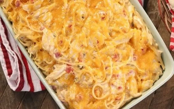 Classic chicken spaghetti with creamy sauce and herbs in a bowl