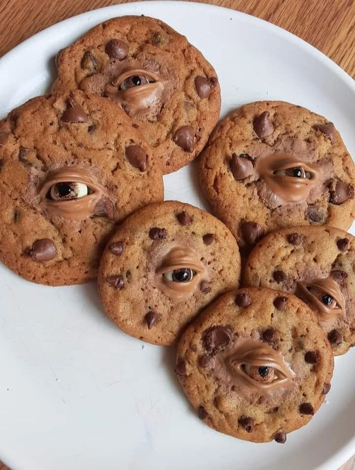 Creepy chocolate chip cookies with spooky decorations