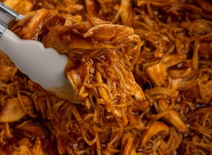 Crock Pot BBQ Pulled Chicken served on a plate with coleslaw
