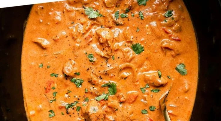 Crockpot Butter Chicken served with rice and garnished with fresh cilantro