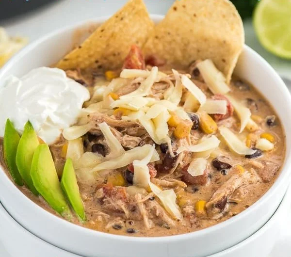 Delicious bowl of crockpot white chicken chili topped with cilantro.