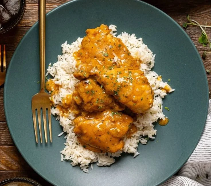 Plate of Delicious Southern Smothered Chicken with gravy and sides