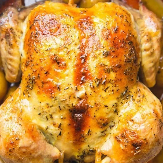 Whole Dutch Oven Chicken cooked to perfection with herbs and spices
