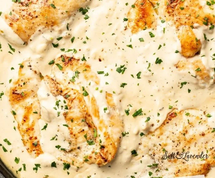 Easy cream cheese chicken dish with herbs and spices for a delicious meal.