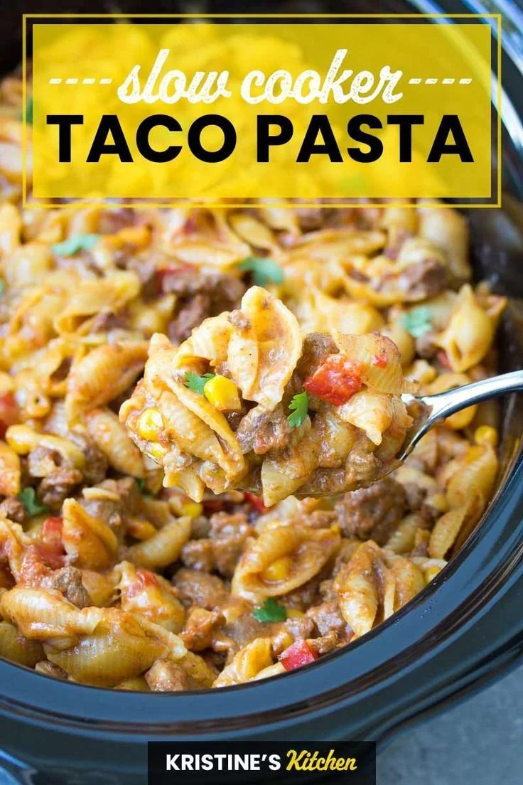 Delicious bowl of Easy Crockpot Taco Pasta topped with cheese and cilantro