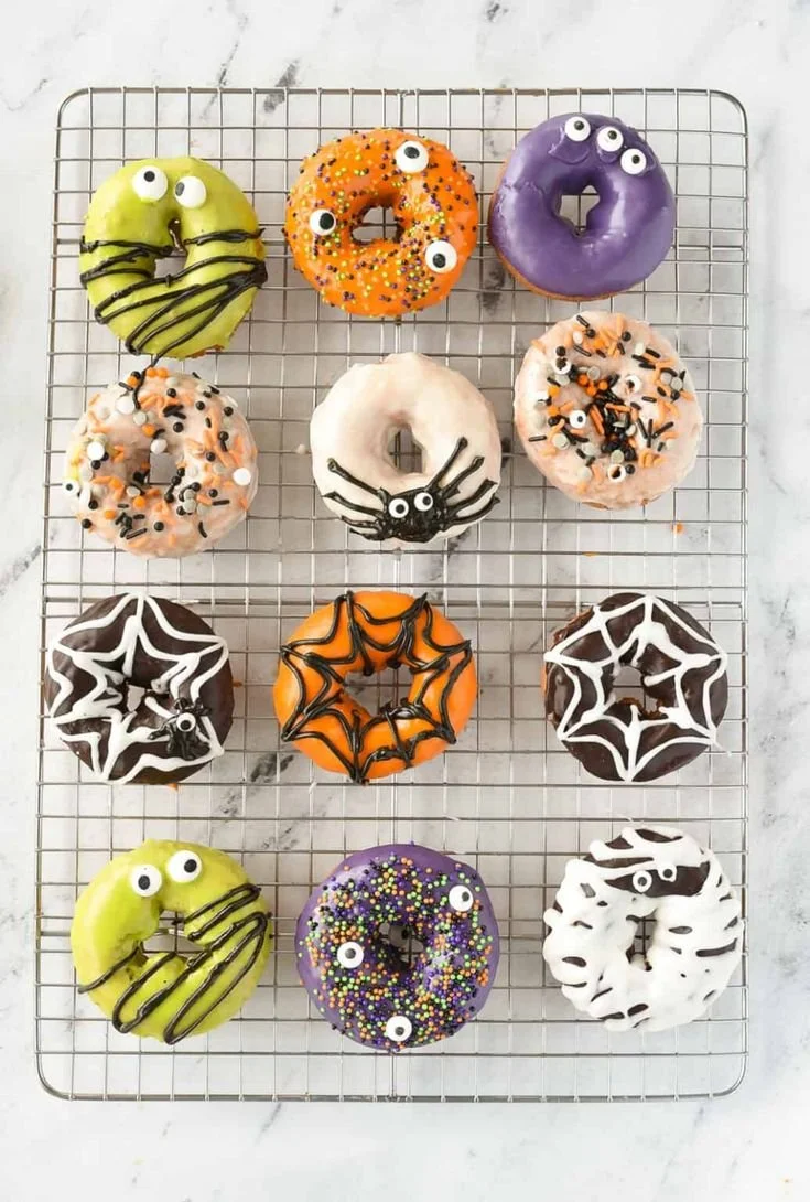 Colorful Halloween donuts decorated with spooky designs for festive celebrations