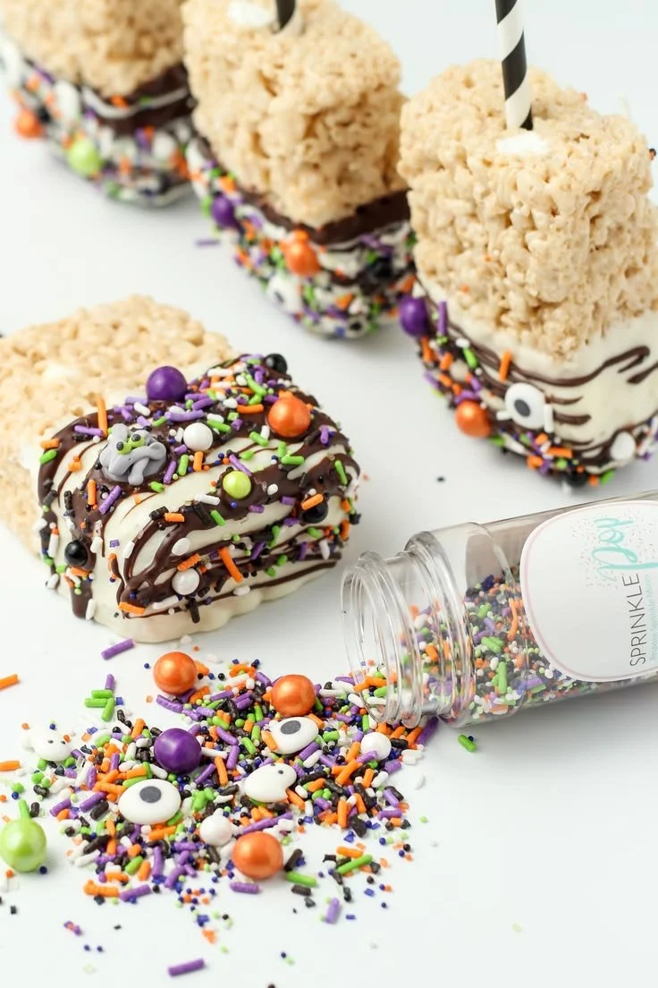 Colorful Halloween Rice Krispie Pops decorated for festive treats
