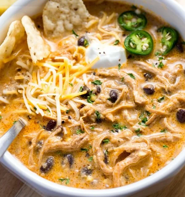 Delicious Instant Pot white chicken chili topped with fresh cilantro in a bowl.