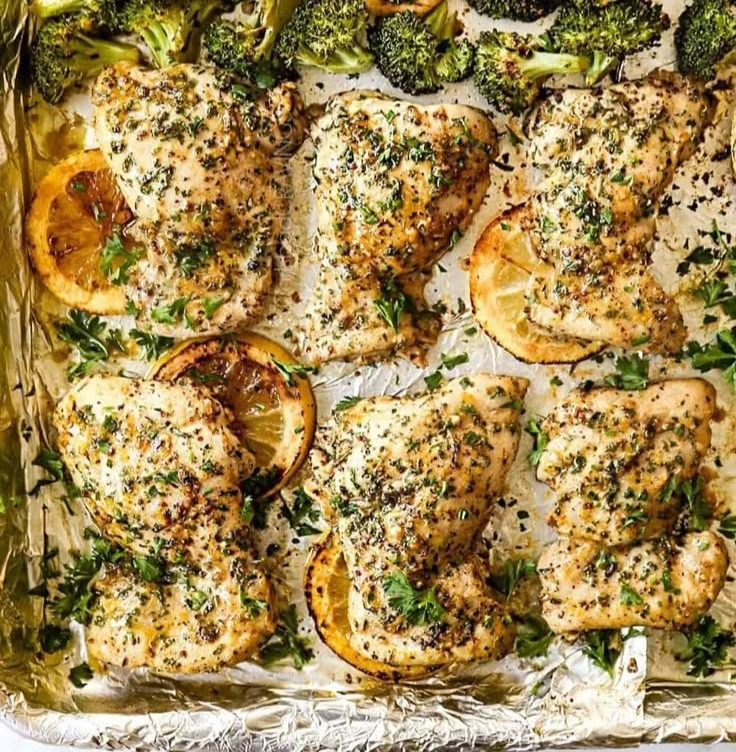 Lemon Garlic Chicken Thighs served with steamed broccoli on a plate