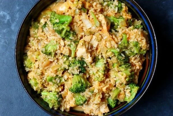 One-pot chicken and rice dish garnished with herbs