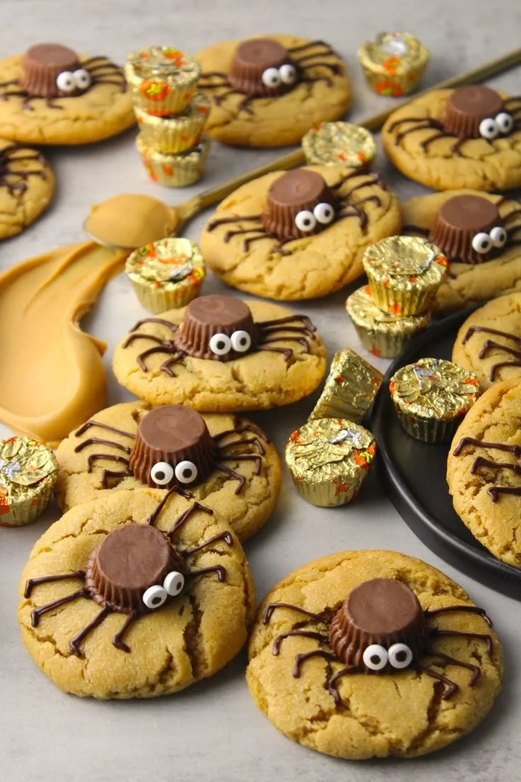 Peanut Butter Spider Halloween Cookies decorated with chocolate and candy.