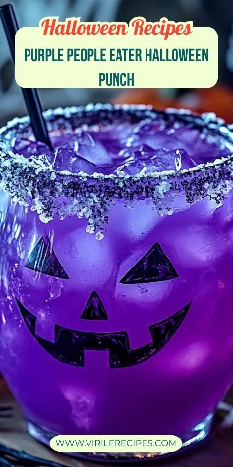 Colorful Purple People Eater Halloween Punch in a spooky glass with Halloween decorations