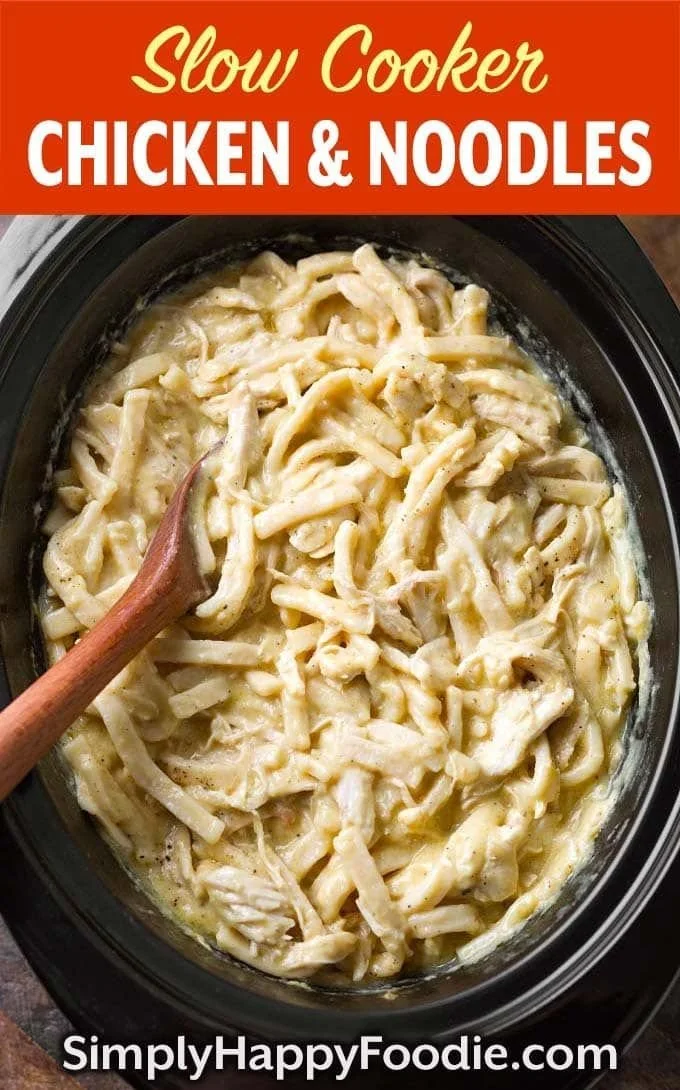 Bowl of slow cooker chicken and noodles served with fresh herbs
