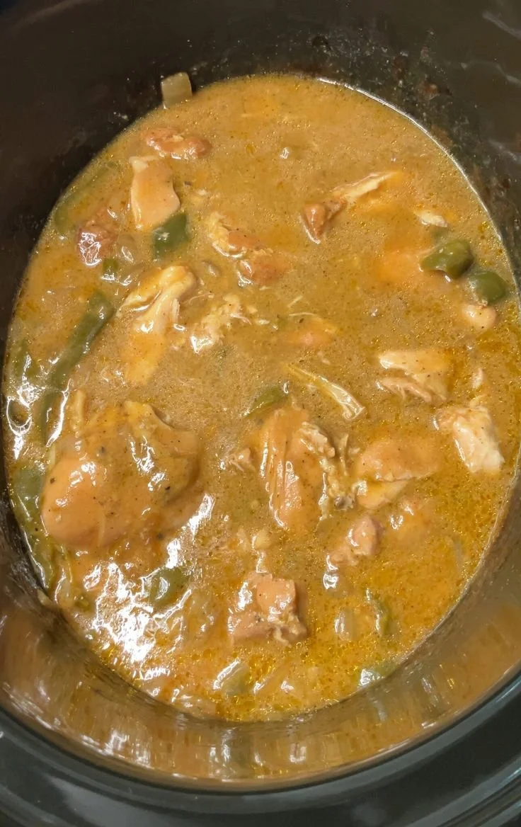 Crockpot smothered chicken served with gravy and sides.