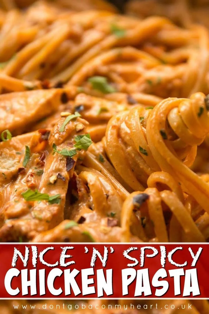 Delicious spicy chicken pasta dish garnished with herbs