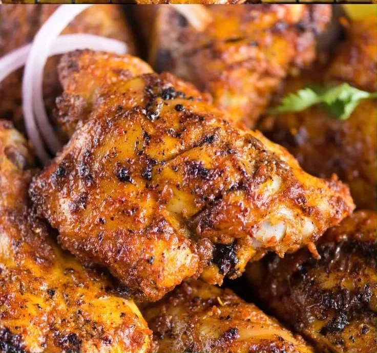 Delicious Tandoori Chicken marinated in spices, served with fresh herbs.
