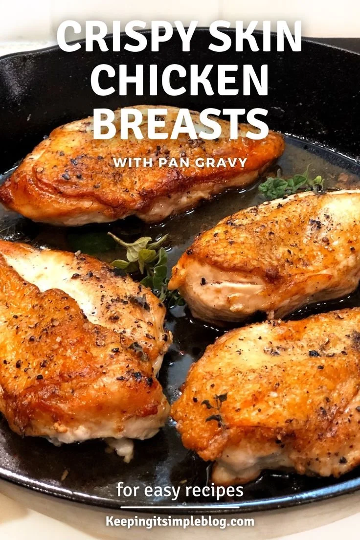 Perfectly seared cast iron chicken breast served on a plate with herbs.