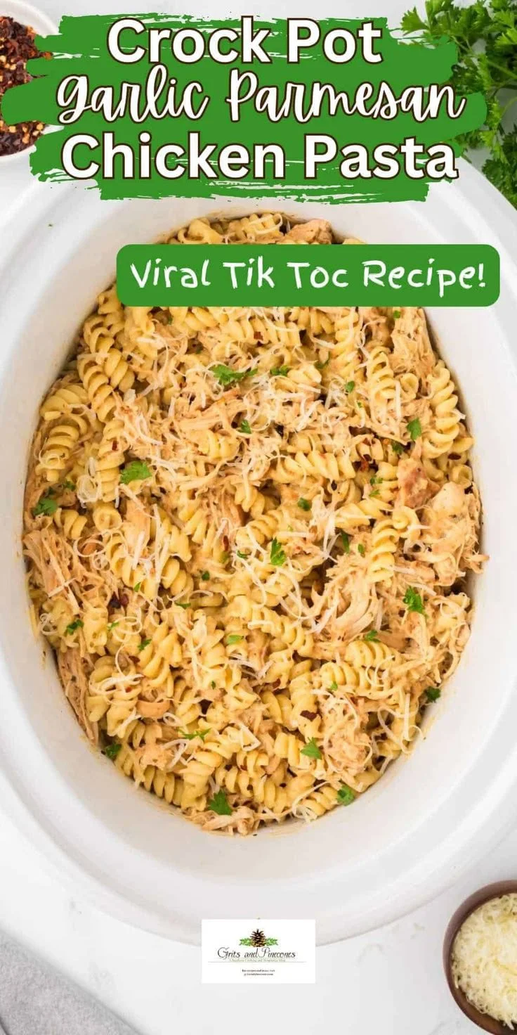Crock Pot Garlic Parmesan Chicken Pasta garnished with parsley and served in a bowl