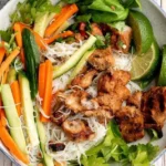 vietnamese noodle bowl with lemongrass chicken 2026 07 04 192219