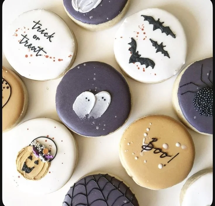 Black and white Halloween treats with DIY decorations for cookies and party desserts
