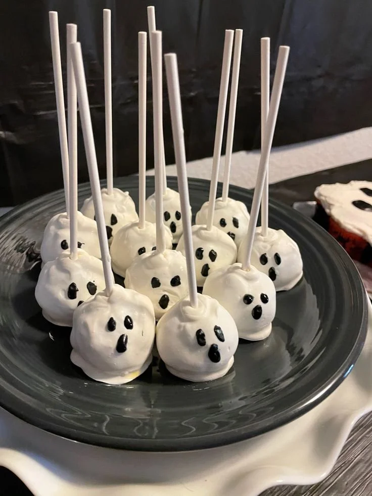 Colorful and festive cake pops arranged on a display for parties.