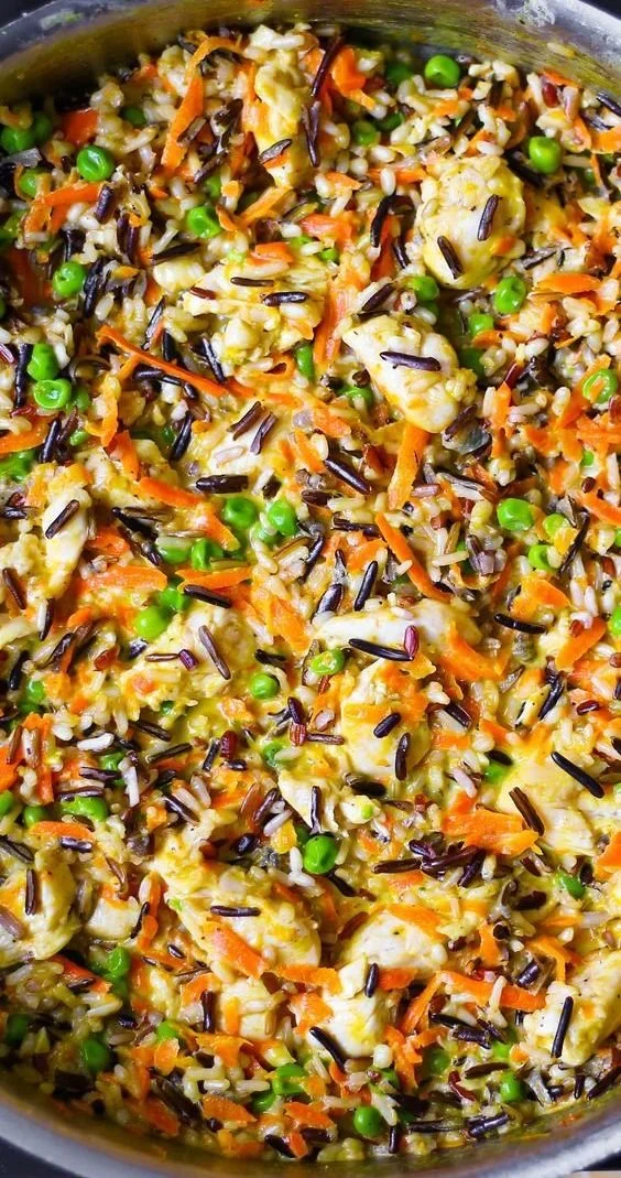 Delicious Chicken Pot Pie Wild Rice Skillet topped with fresh herbs