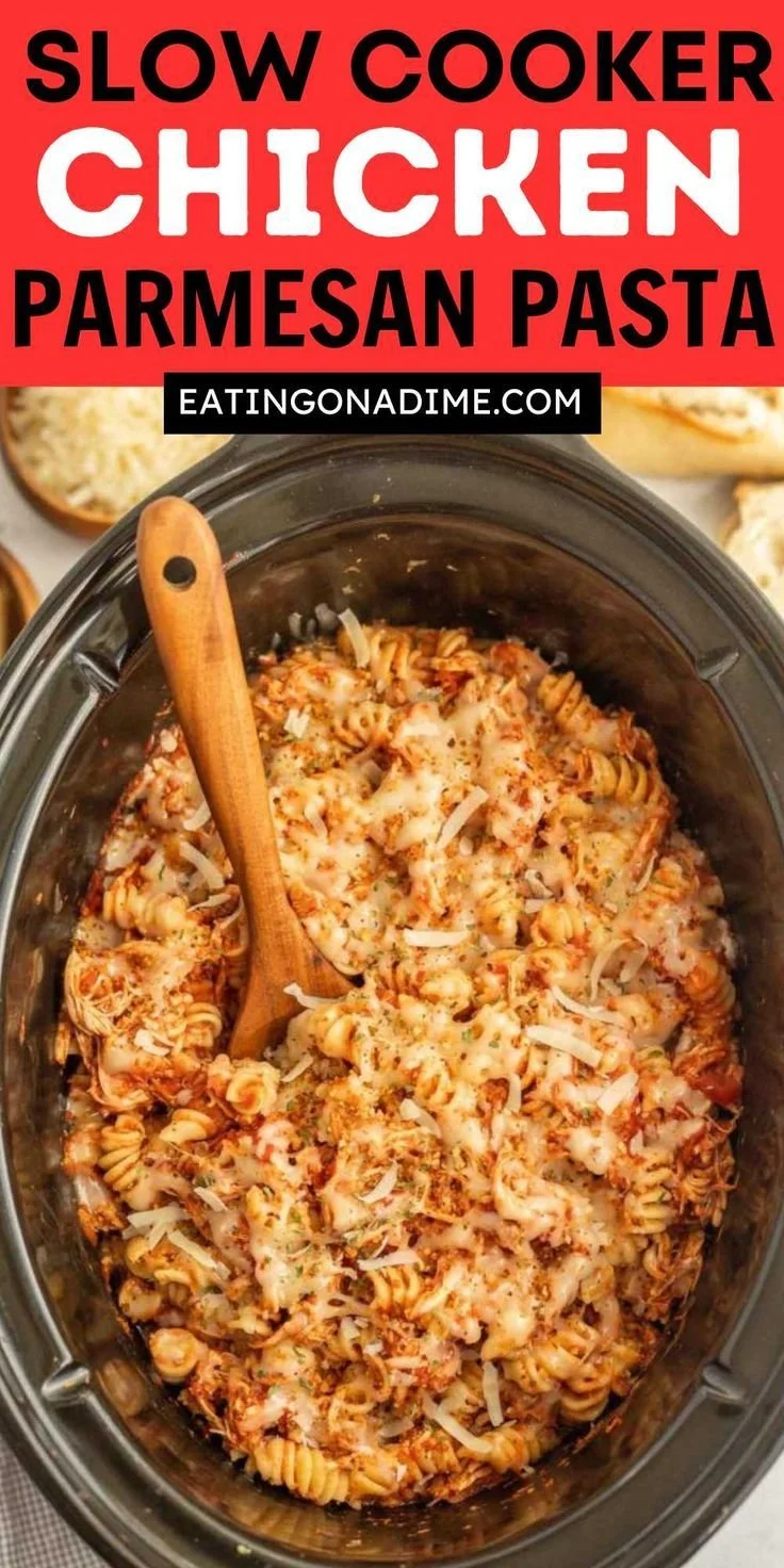 Crock Pot Chicken Parmesan Pasta in a bowl with melted cheese and herbs