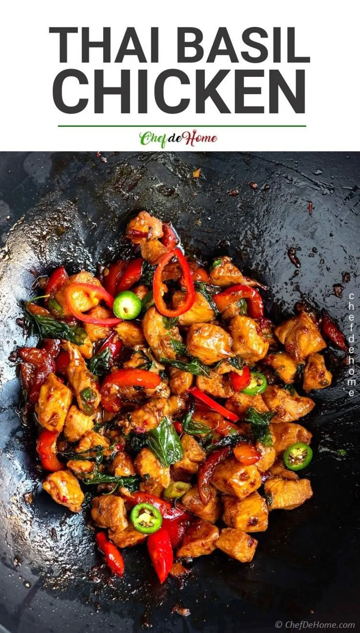 Delicious Thai Basil Chicken served on a plate, garnished with fresh basil leaves.