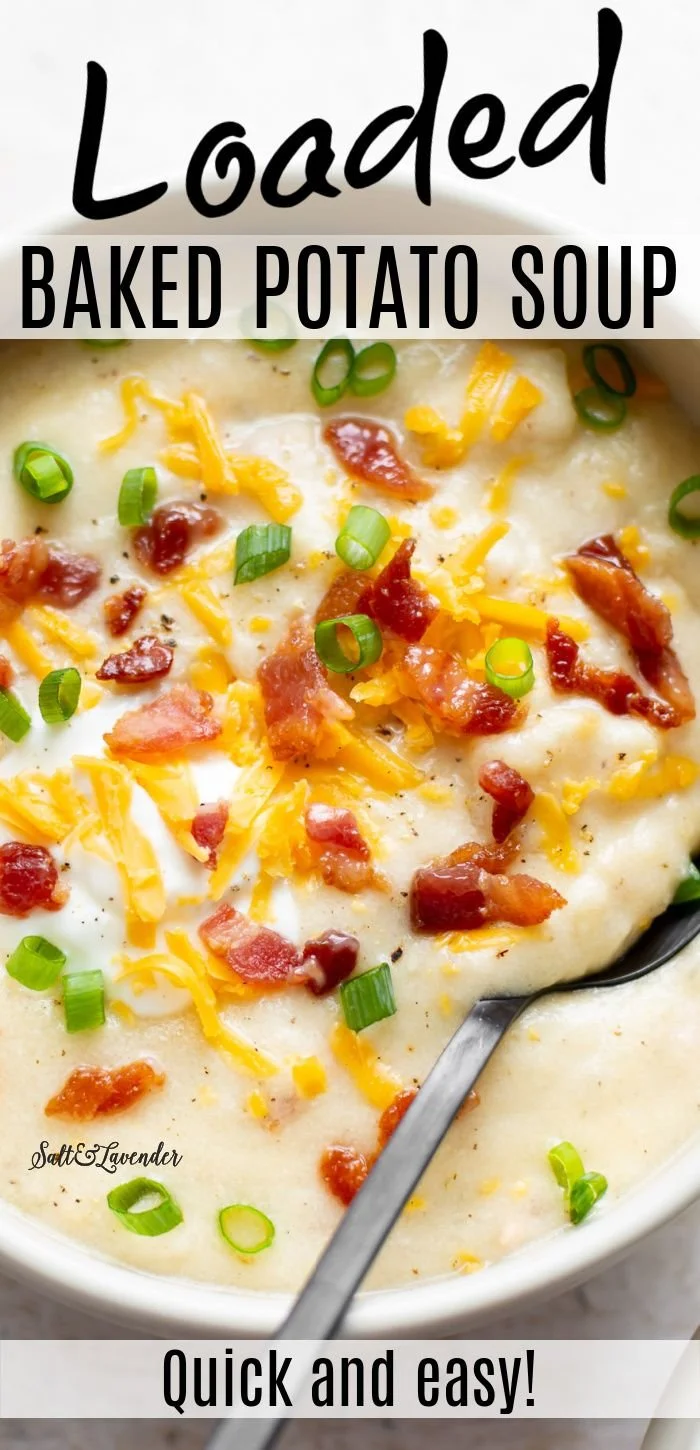 Bowl of creamy baked potato soup topped with chives and cheese