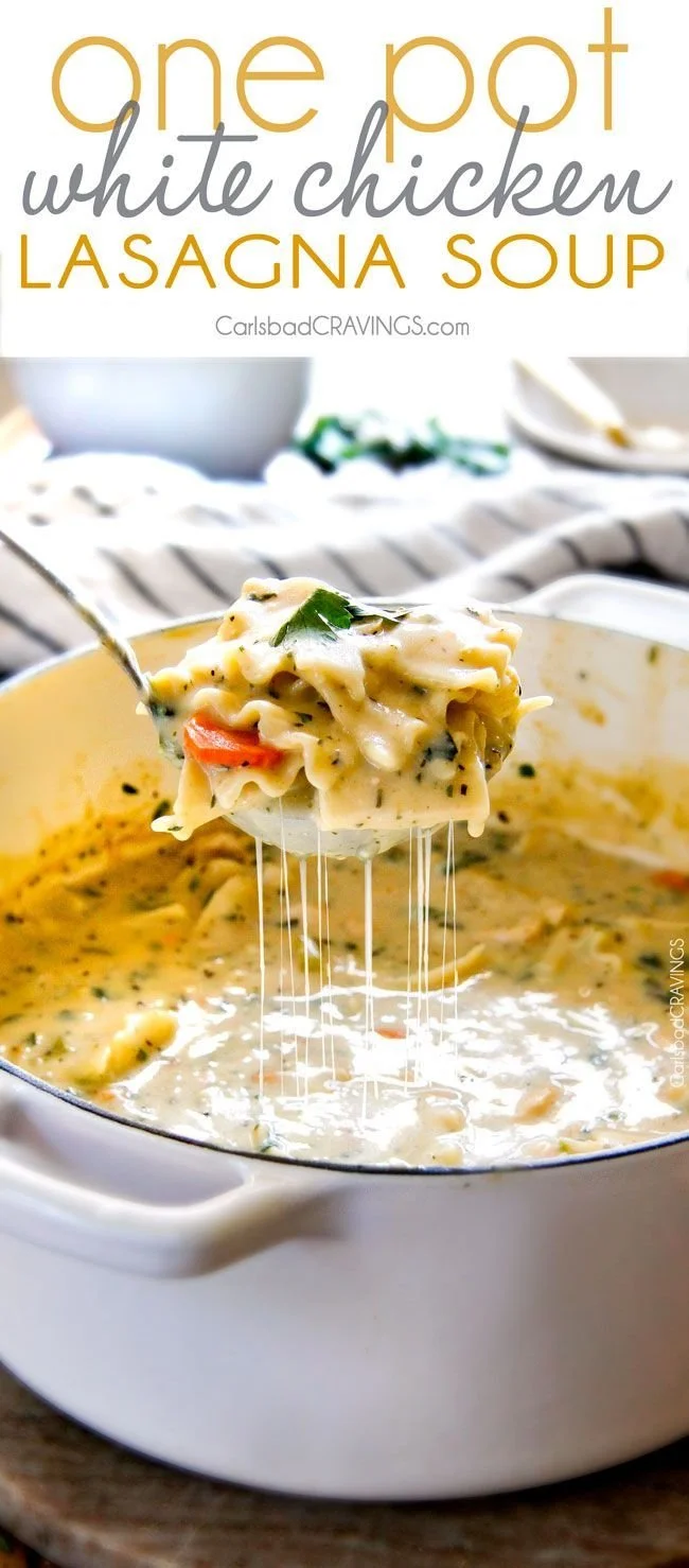 Bowl of creamy white chicken lasagna soup with cheese and herbs