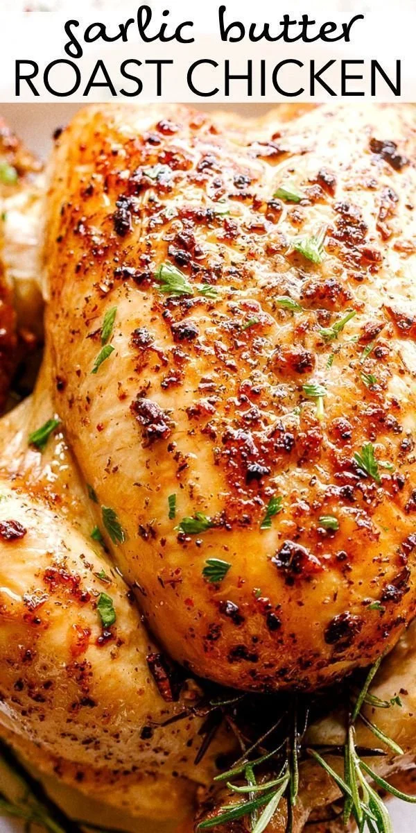 Deliciously roasted chicken with herbs and vegetables on a serving platter.