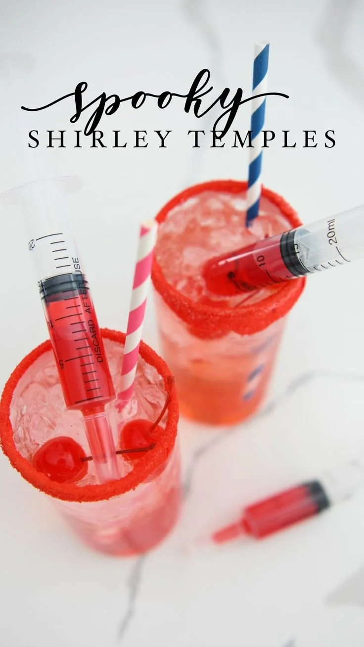 Easy spooky Shirley Temple Halloween mocktail in a festive glass with garnishes