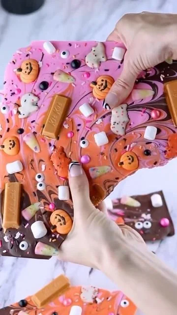 Colorful Halloween candy and treats displayed for a festive party
