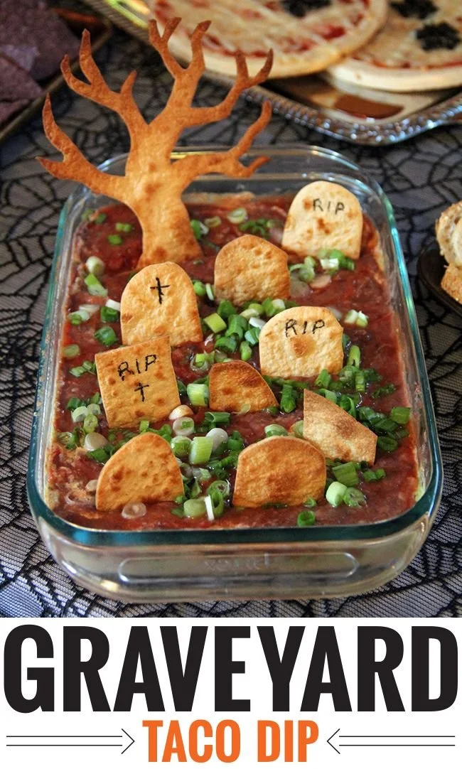 Delicious Graveyard taco dip served in a themed Halloween display.