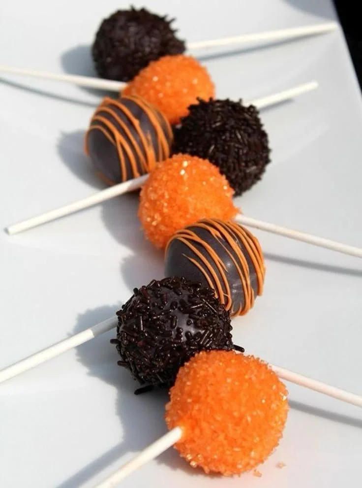 Colorful Halloween cake pops decorated for a spooky party.