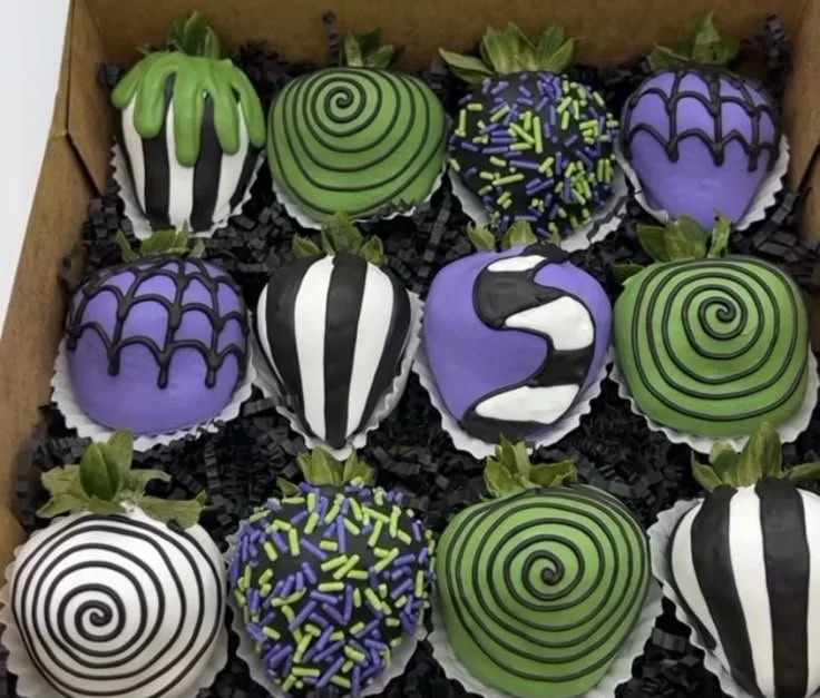 Halloween chocolate covered strawberries decorated for spooky celebrations