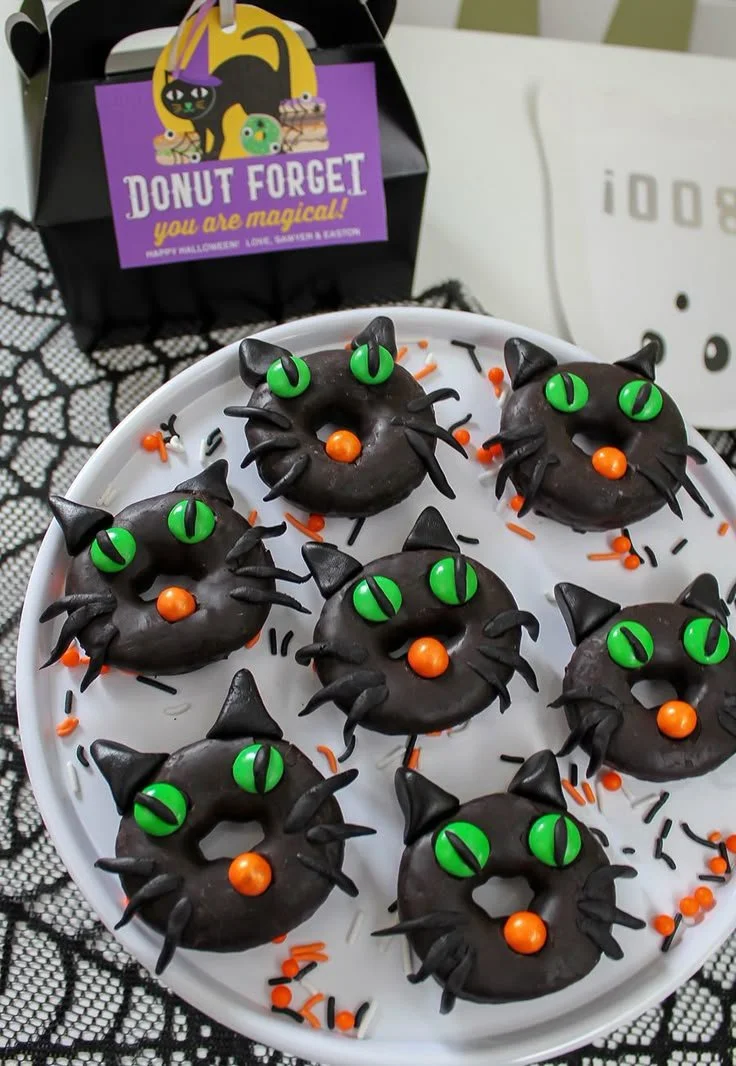 Halloween donut shop party setup with festive decorations and treats.