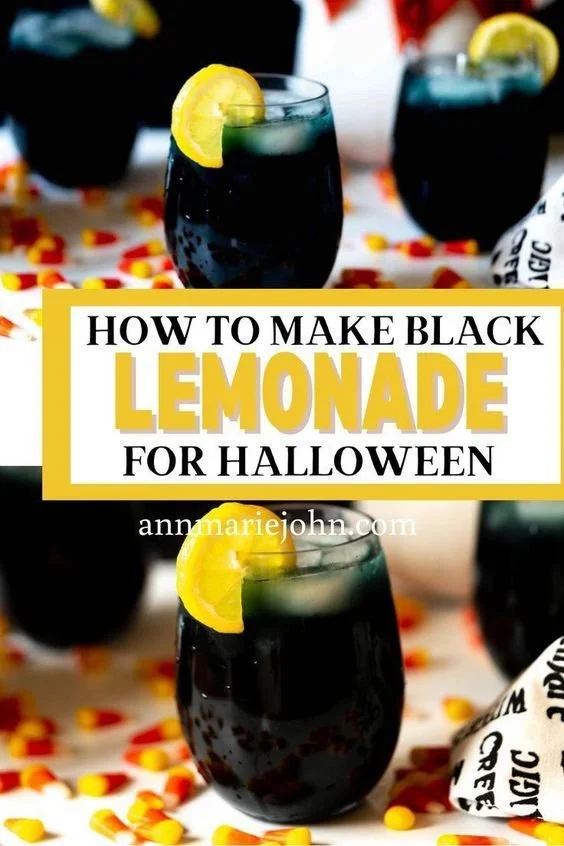 Glass of devilishly black lemonade served for Halloween