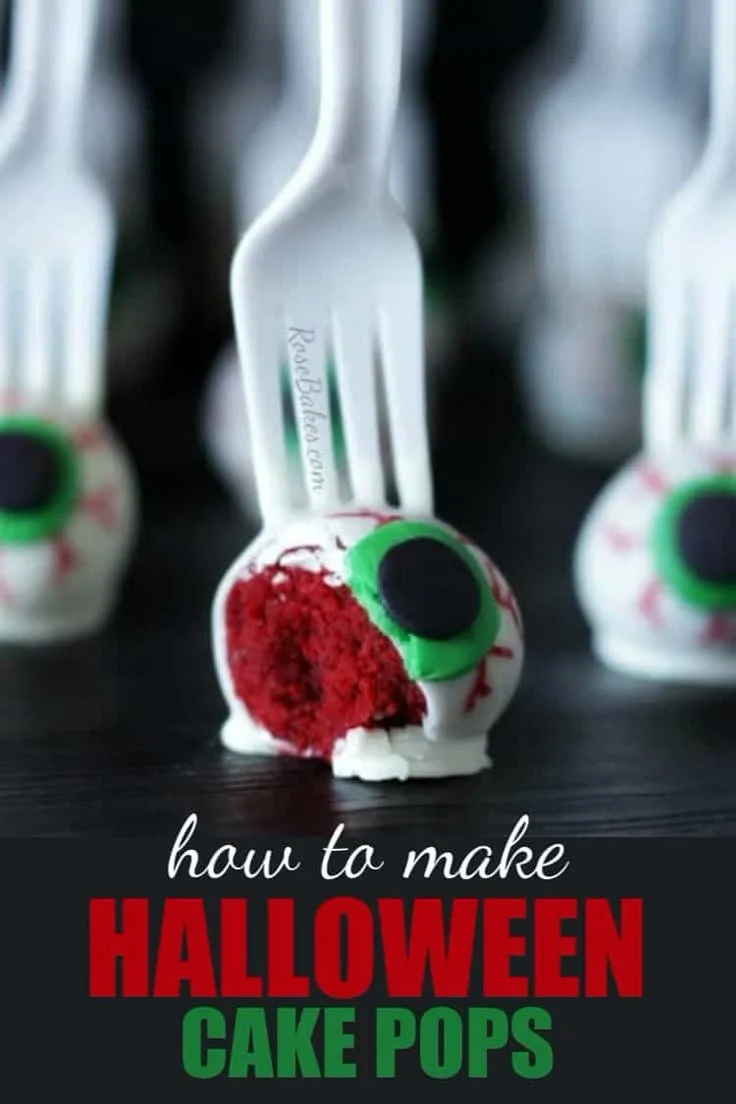Halloween cake pops with eyeballs on a fork, perfect for spooky celebrations.