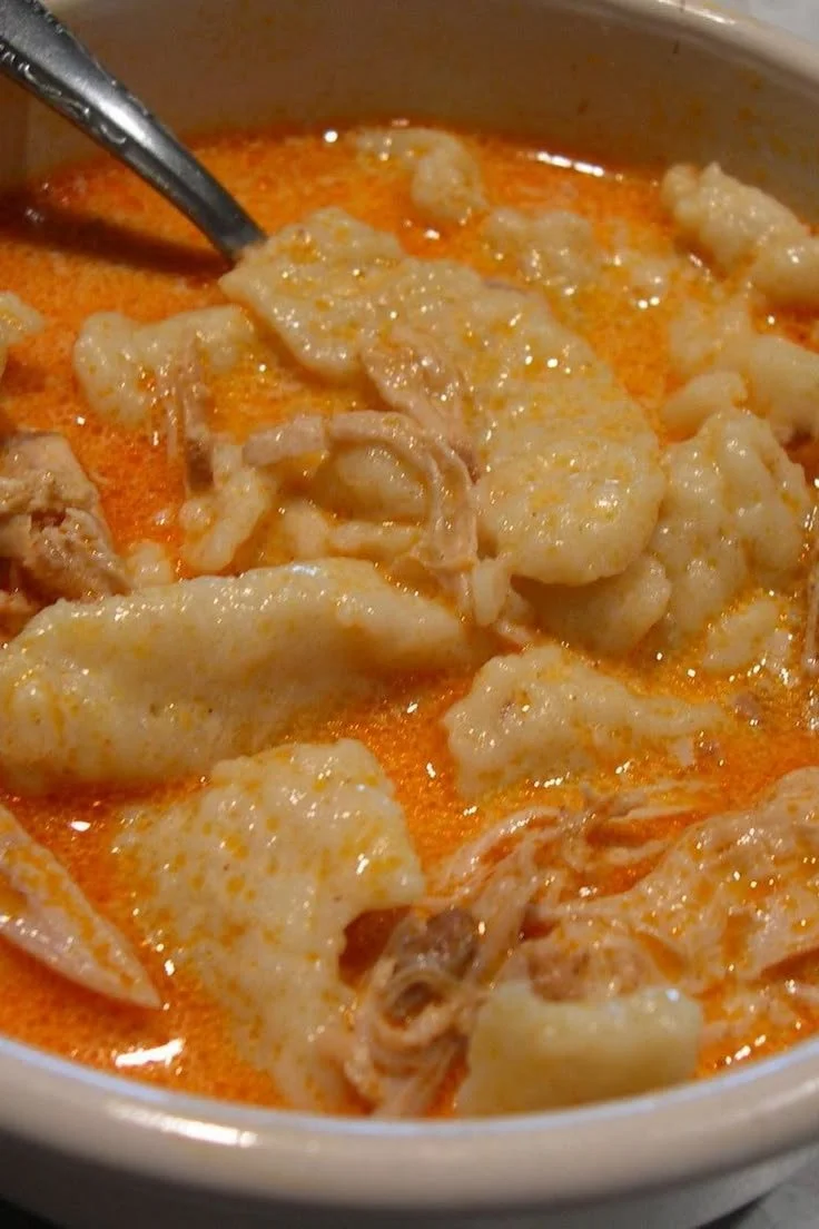 Authentic Hungarian Chicken Paprikash served with creamy sauce and paprika seasoning.