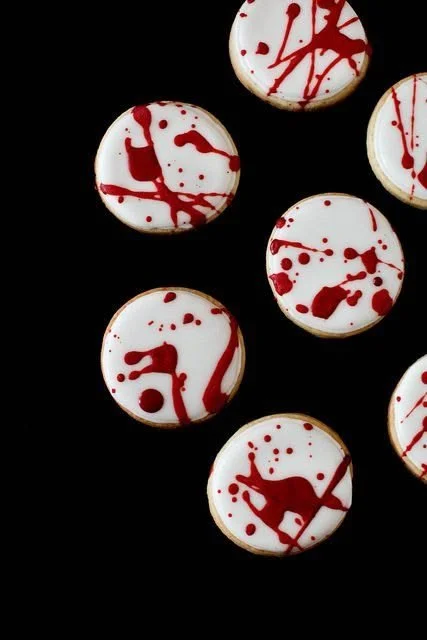 A variety of fun and festive Halloween cookies decorated with spooky designs.